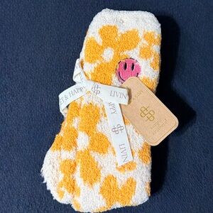 Simply Southern Yellow and White Flower Camper socks with a Smiley Face